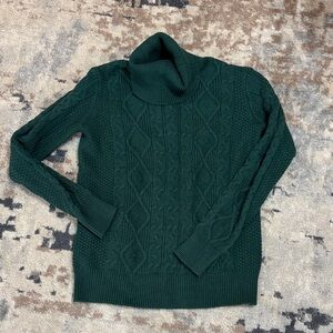 Green cable knit turtleneck sweater